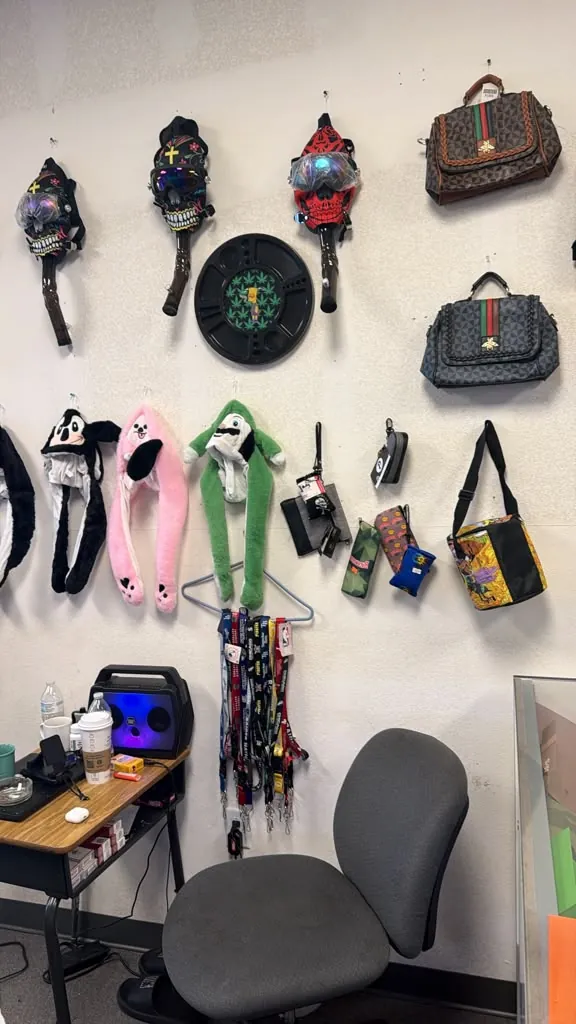 Bags, hats, and novelty items on the wall