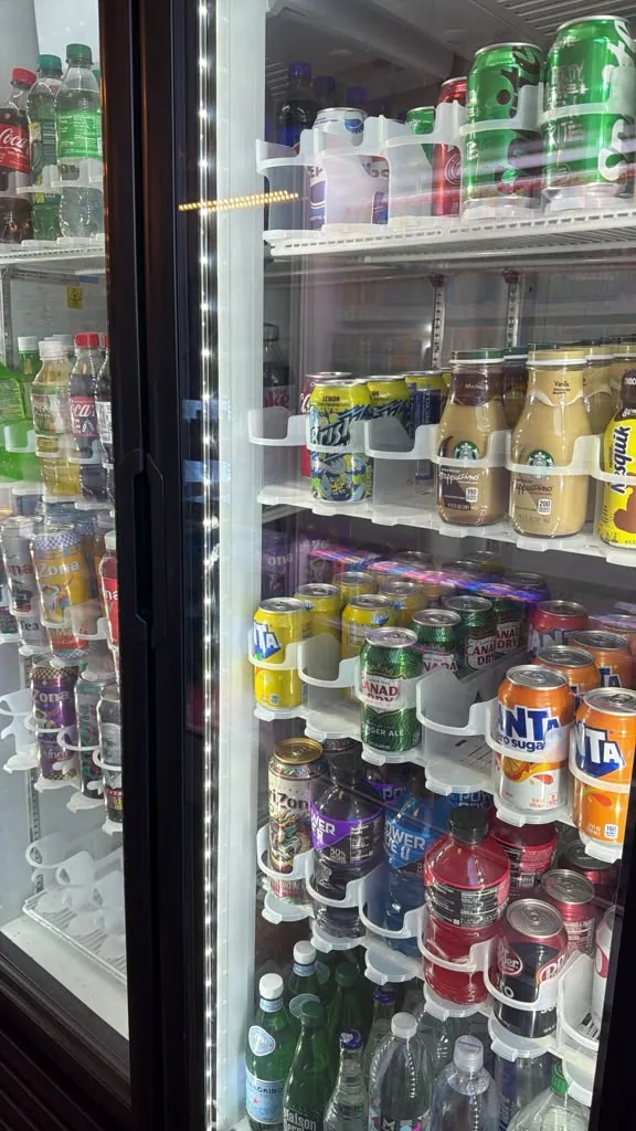 A cooler stocked with sodas and juices