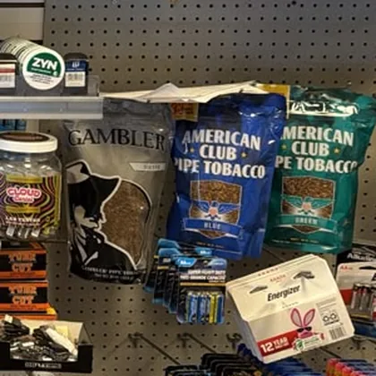 Bags of pipe tobacco on the shop wall