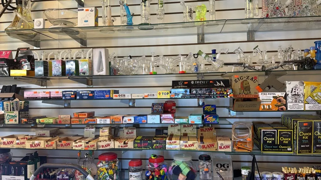 Rolling papers, cones, and glass on display