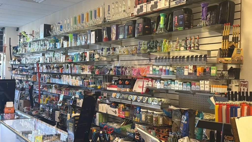 The main wall of glass, tobacco, and accessories behind the counter